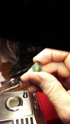 This is a by hand practice opal, turned out to be Black, and decent.  Needs soft edges and polishing.  About 3.2 carats now, but thin, 3.5MM