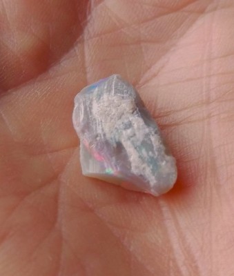 This small piece is a Coober Pedy opalized shell, maybe a clam shell piece.  I was attracted to the visible red color, and of course had visions of grandeur...lol...(it did turn out, just not the way I expected)...