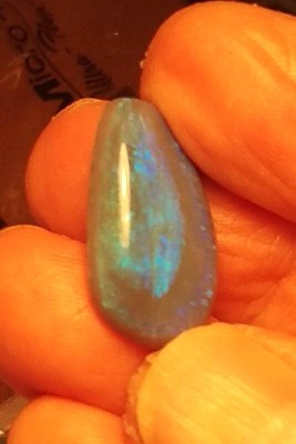 A mostly drop shaped blue and teal opal.  Details below in an additional post...